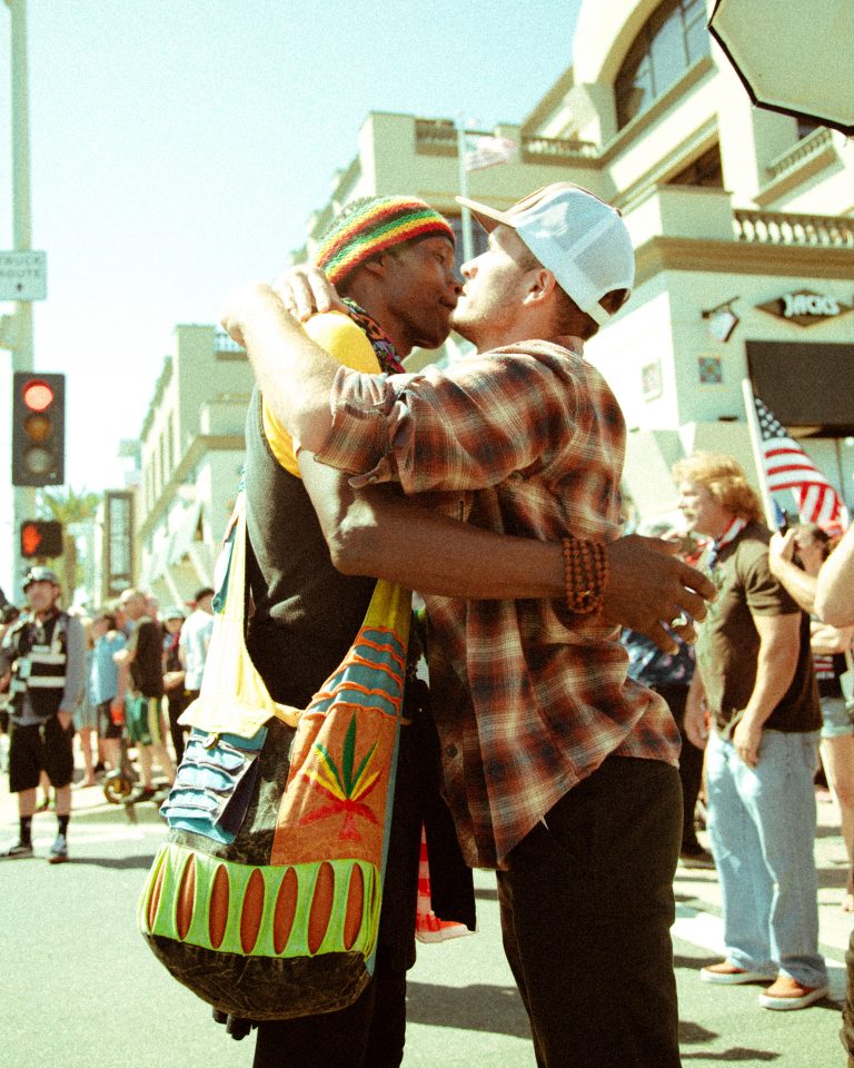 Two men hug it out at protest rally